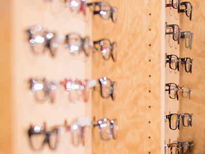 frameboard holding multiple pairs of eyeglasses in Tulsa
